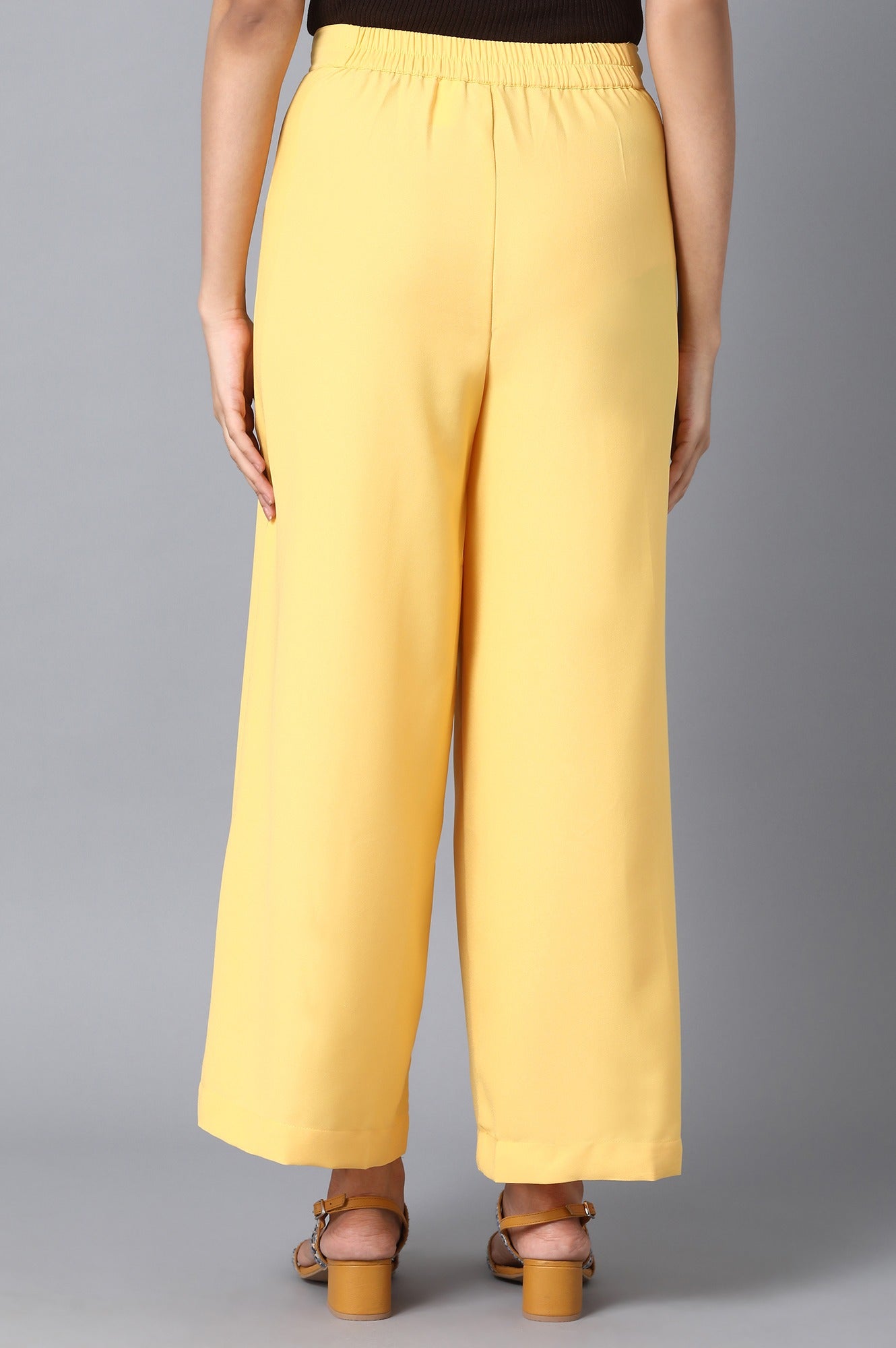 Yellow Solid Flared Woven Palazzo With Front Zip