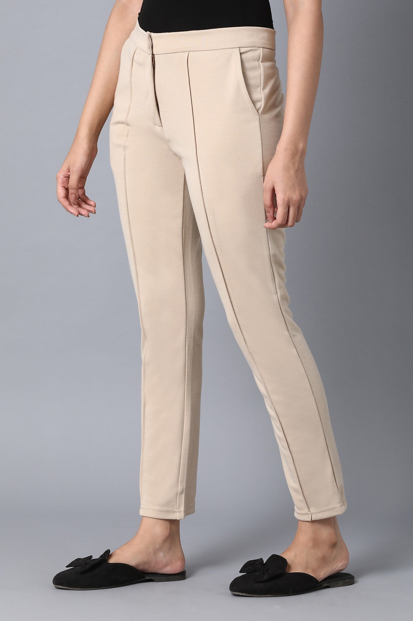 Beige Solid Tapered Pants With Front Zip Closure
