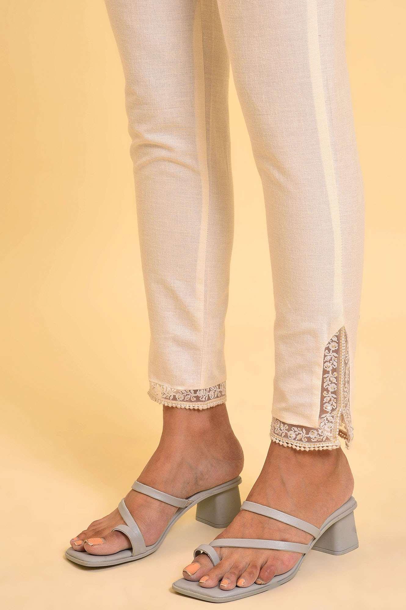 Ecru Solid Slim Pants With Lace On Hem - wforwoman