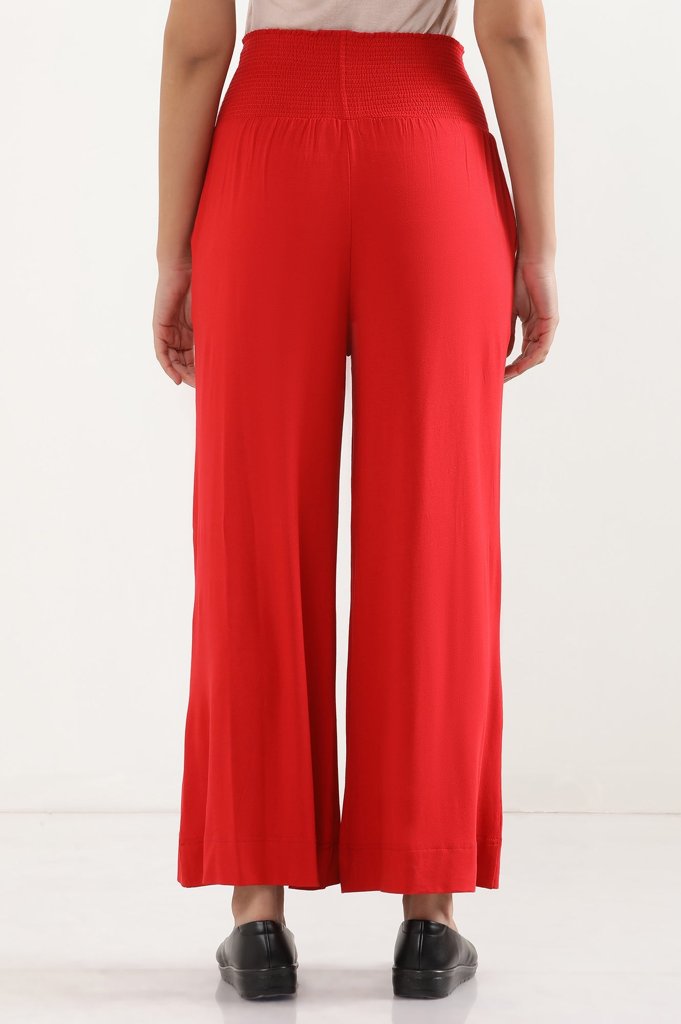 Red Solid Flared Pants With Smocked Waistbelt