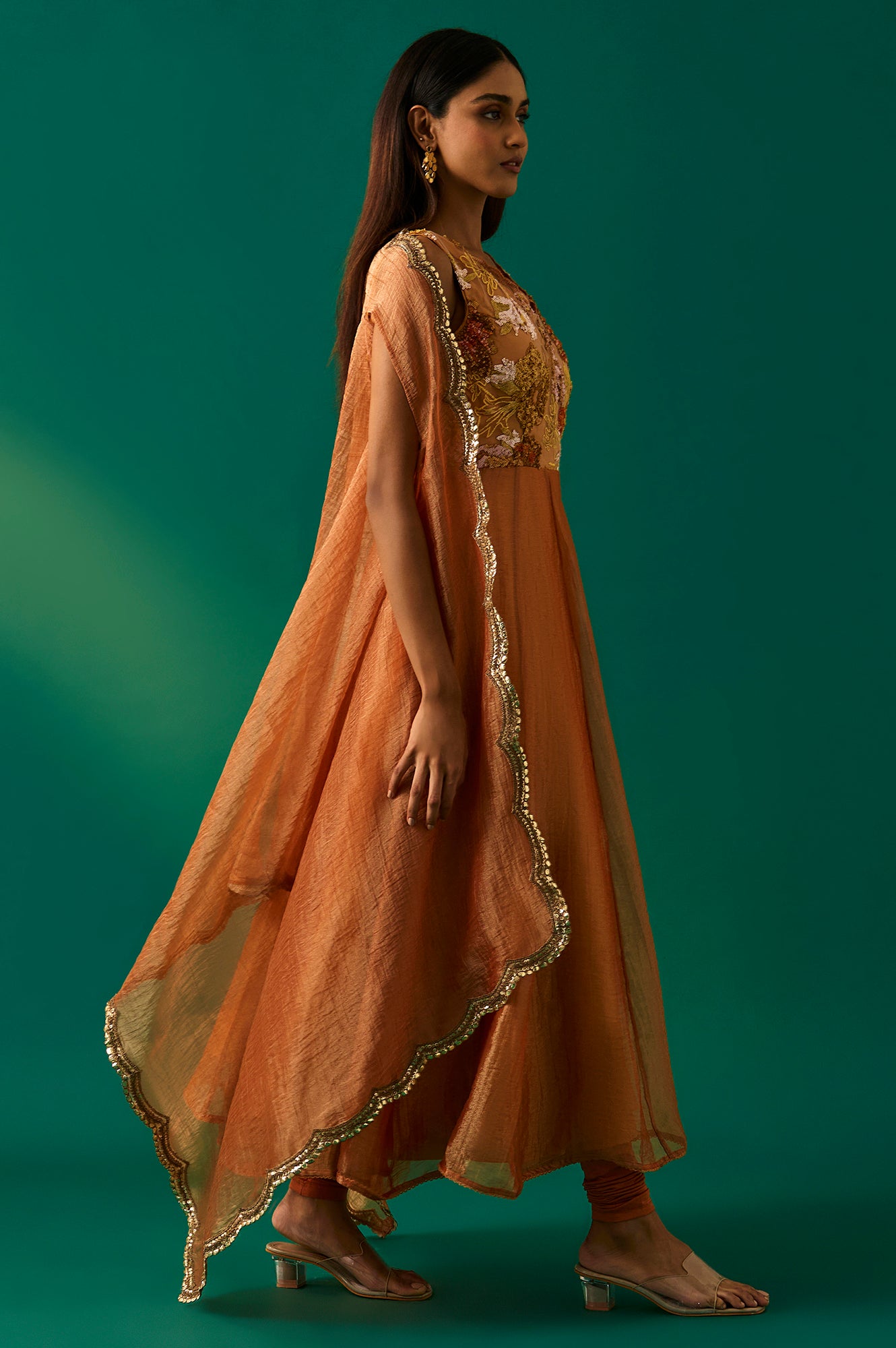Orange Embroidered Flared Net Dress with Churidar and Cape Set