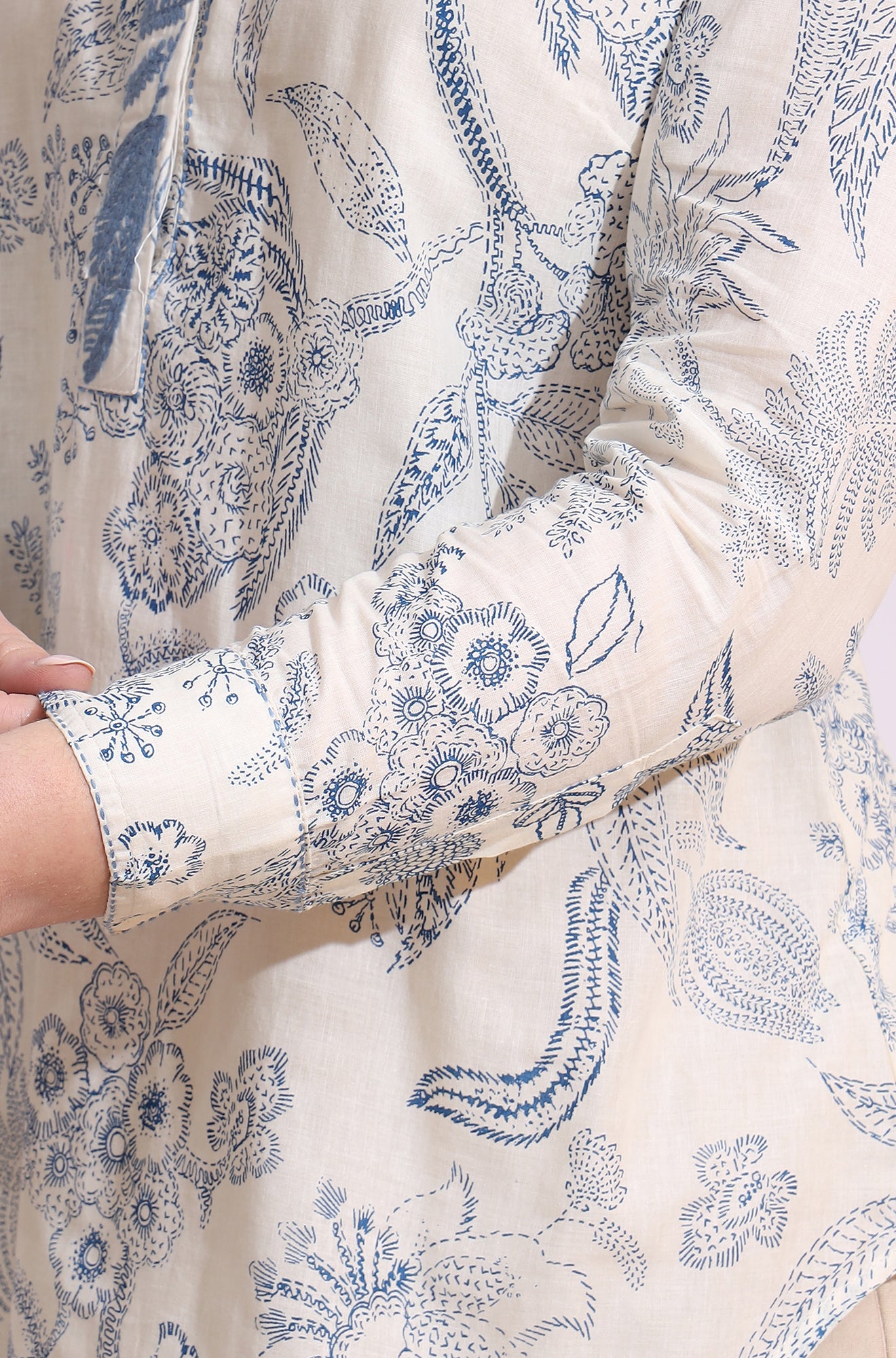 White and blue printed top with thread embroidery