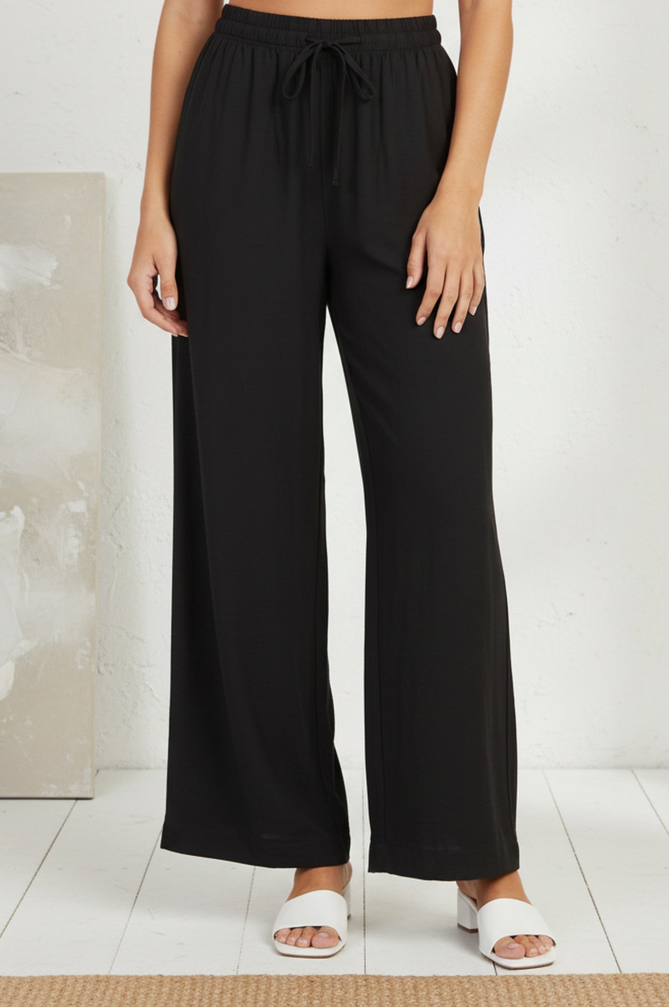 Buy Black Solid Rayon Relaxed Fit Rayon Blend Flared Pants Online
