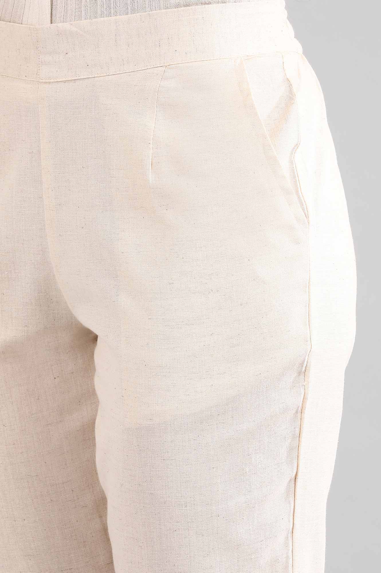 Beige Solid Straight Fit Cotton Trousers With Elasticated Back