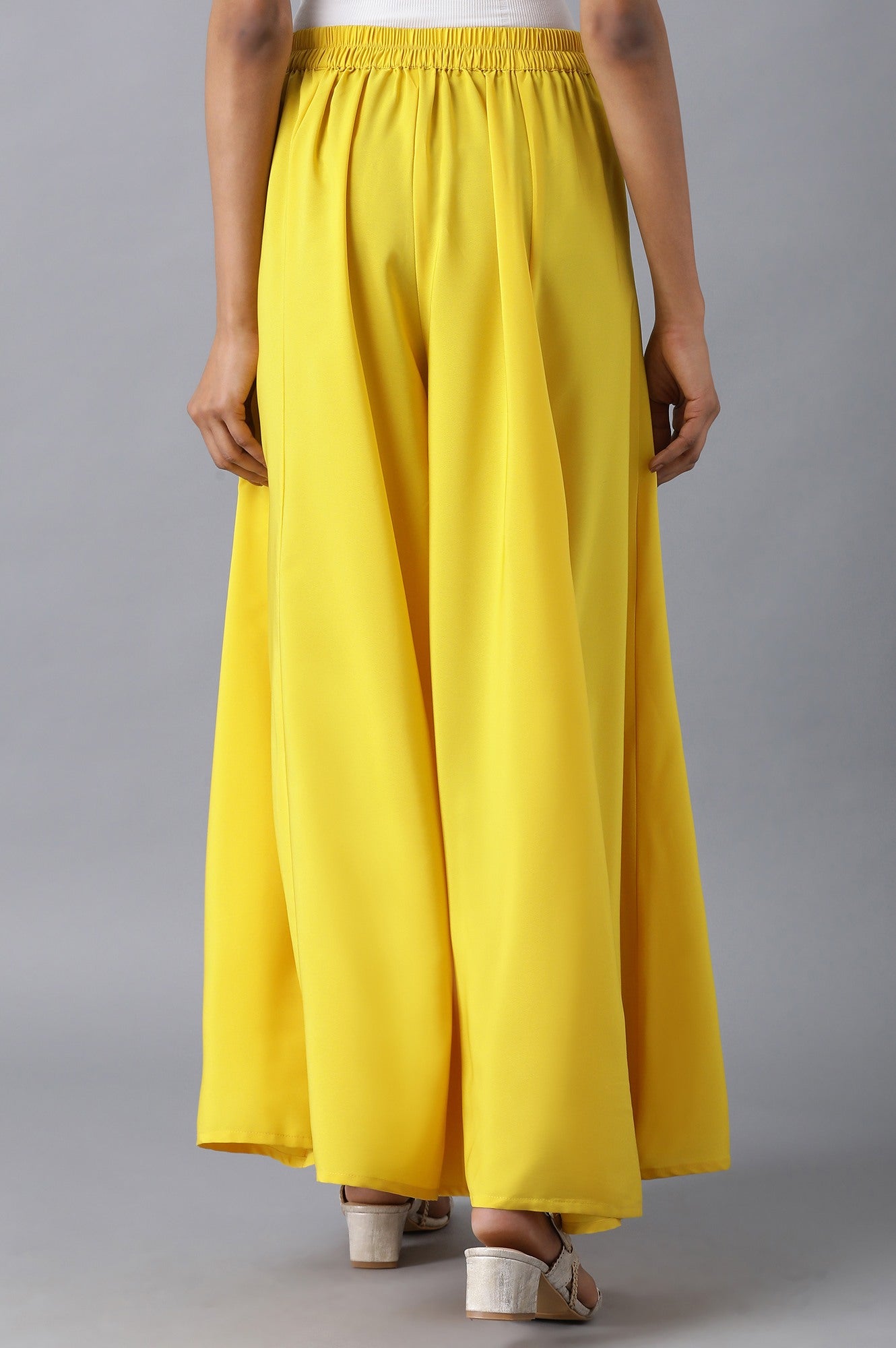 Yellow Solid Flared Woven Pants with Elasticated Waistband