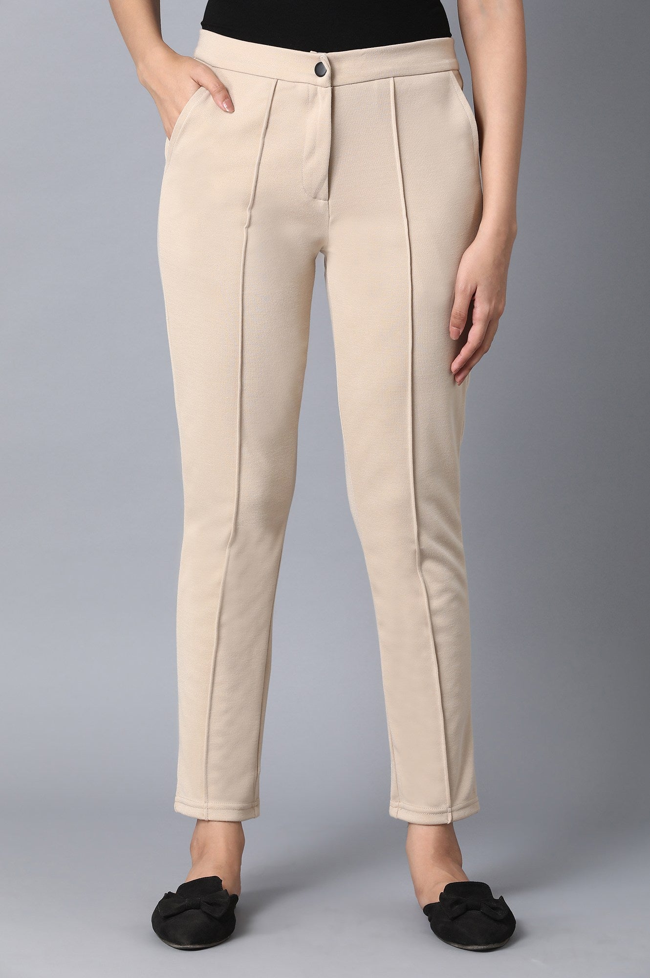 Beige Solid Tapered Pants With Front Zip Closure