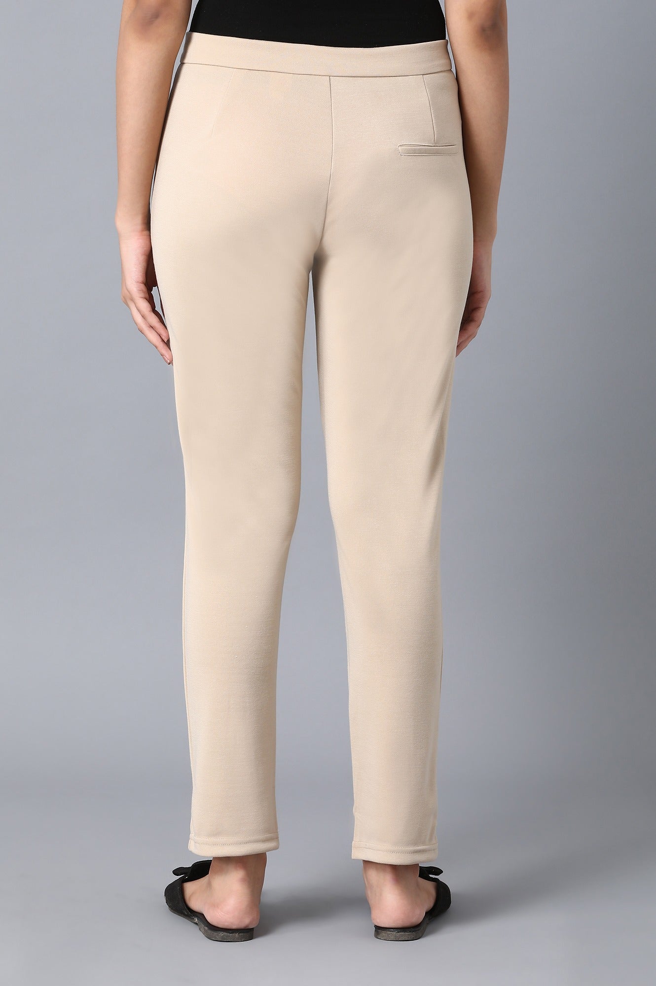 Beige Solid Tapered Pants With Front Zip Closure