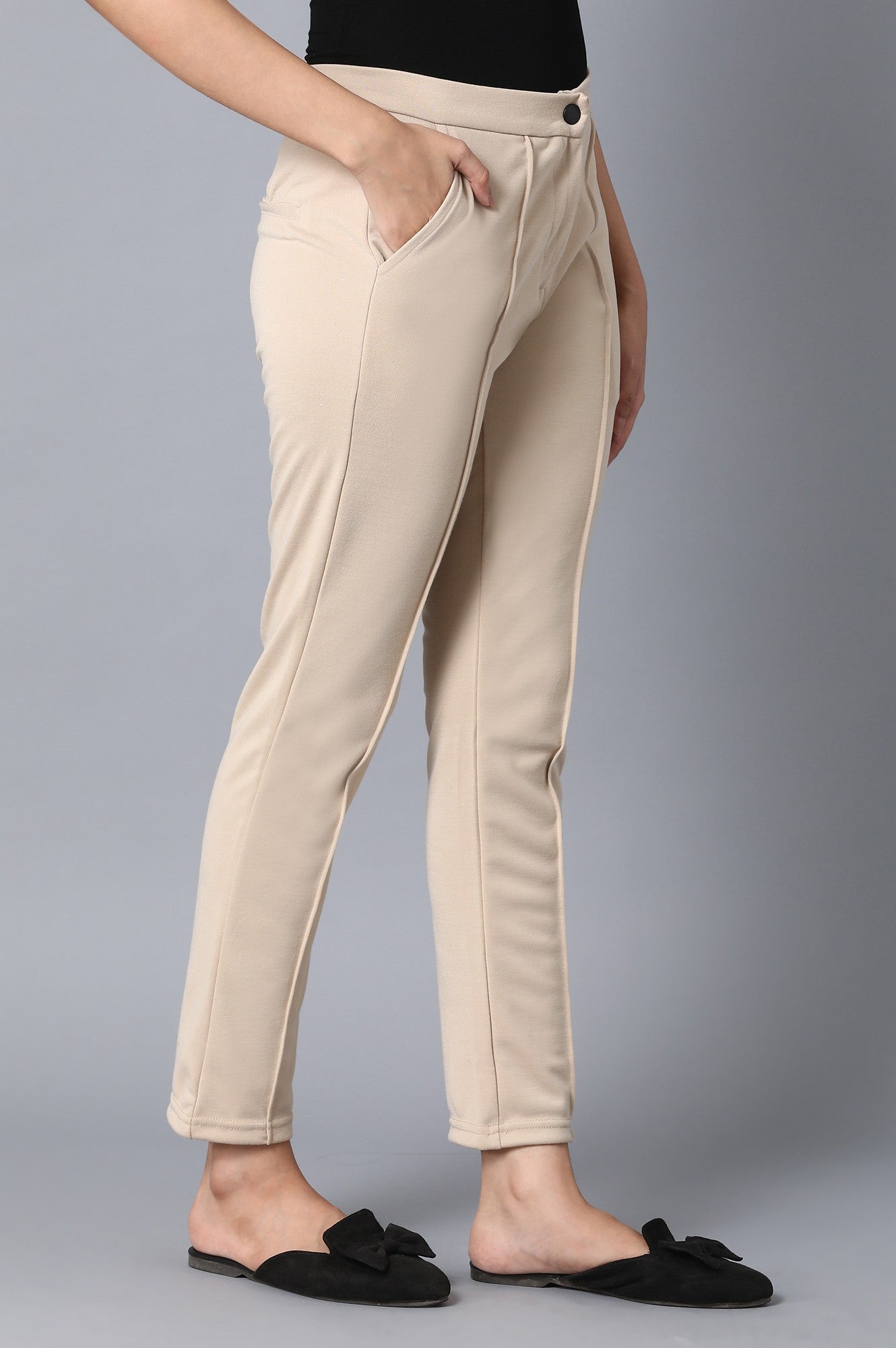 Beige Solid Tapered Pants With Front Zip Closure