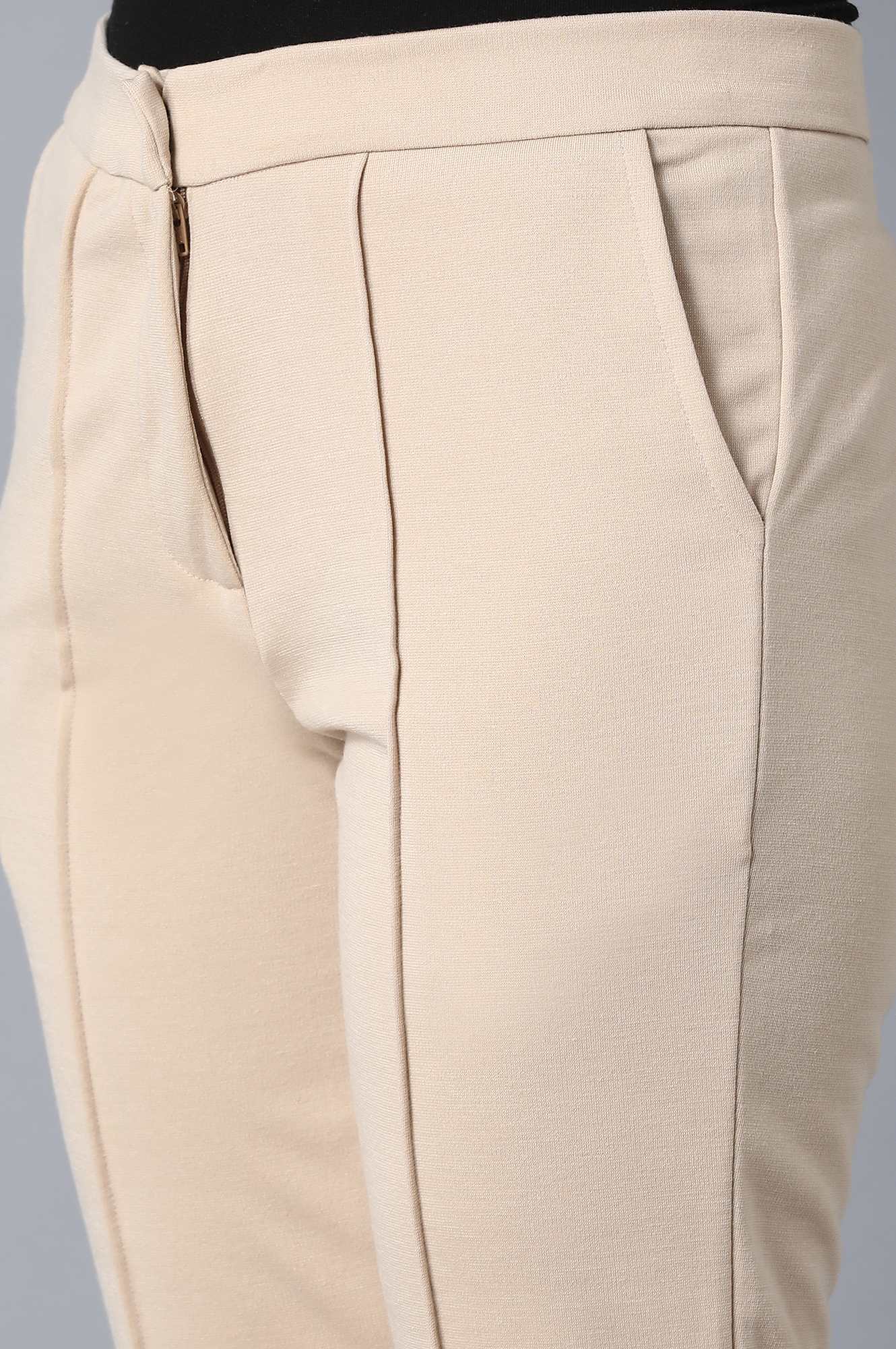 Beige Solid Tapered Pants With Front Zip Closure