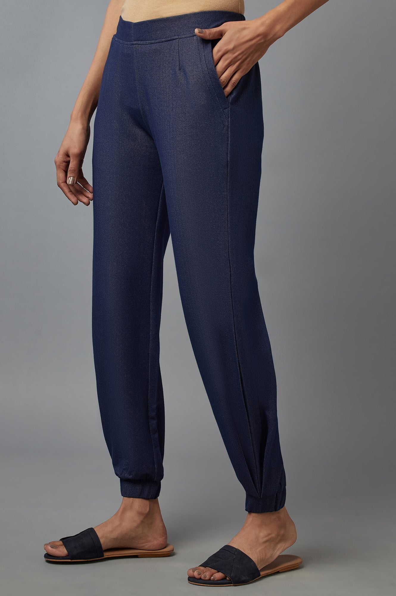 Navy Blue Solid Tapered Cotton Pants With Pleated Detail