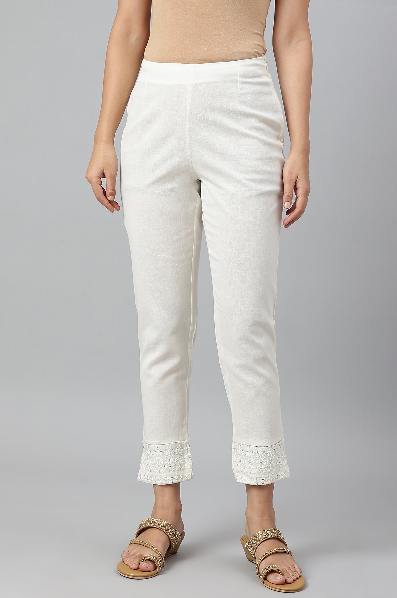 Ecru Slim Pants With Embroidered Hem