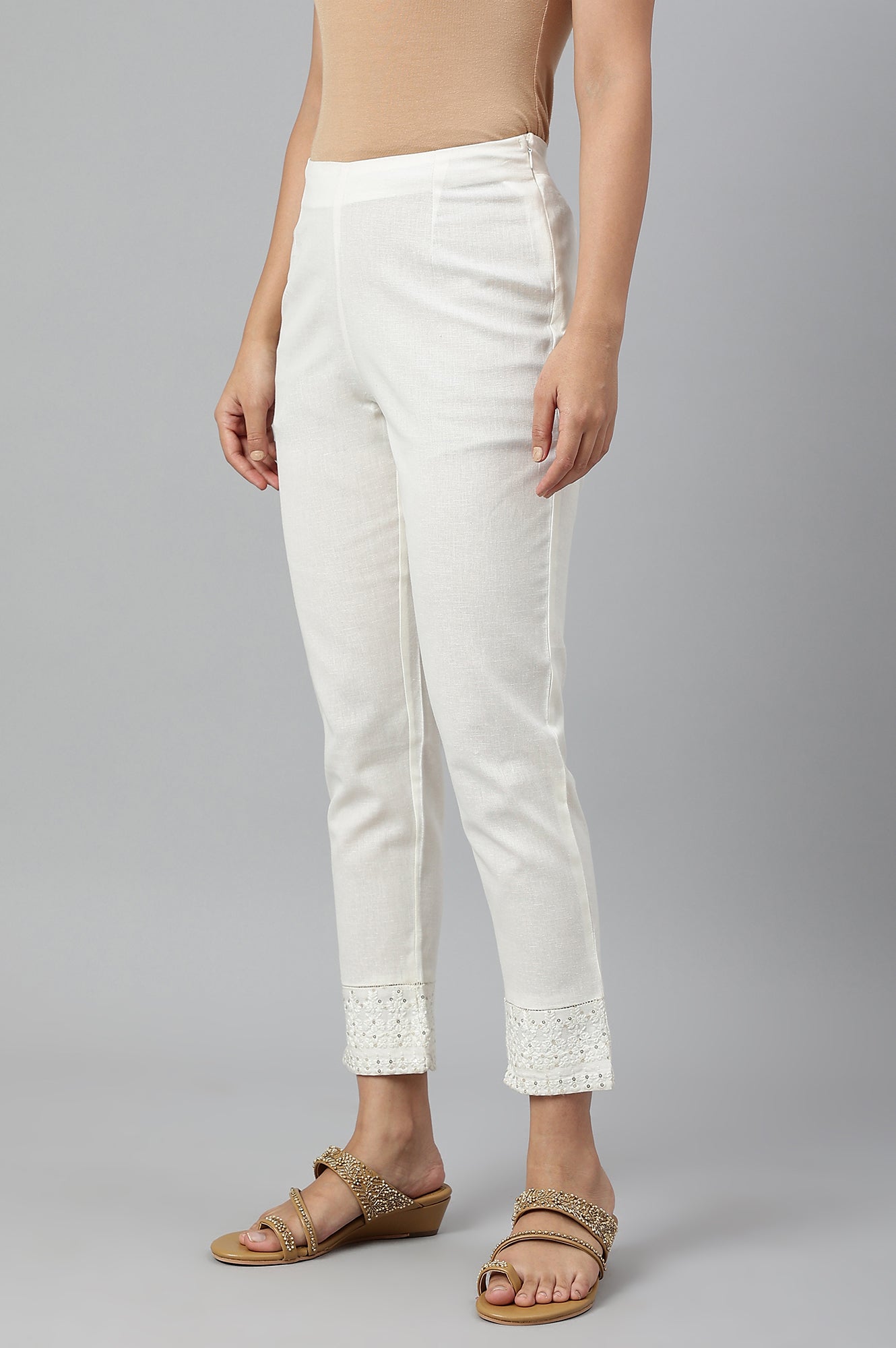 Ecru Slim Pants With Embroidered Hem