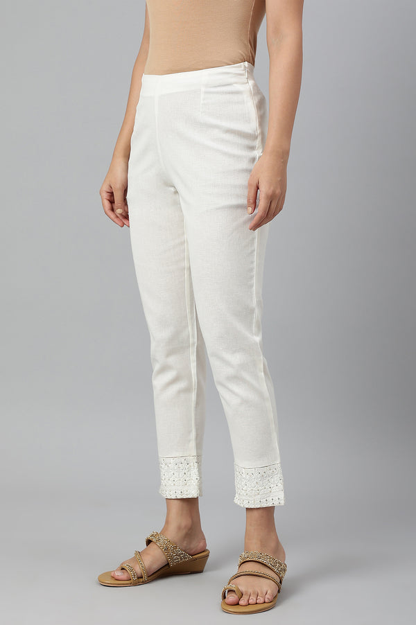 Ecru Slim Pants With Embroidered Hem
