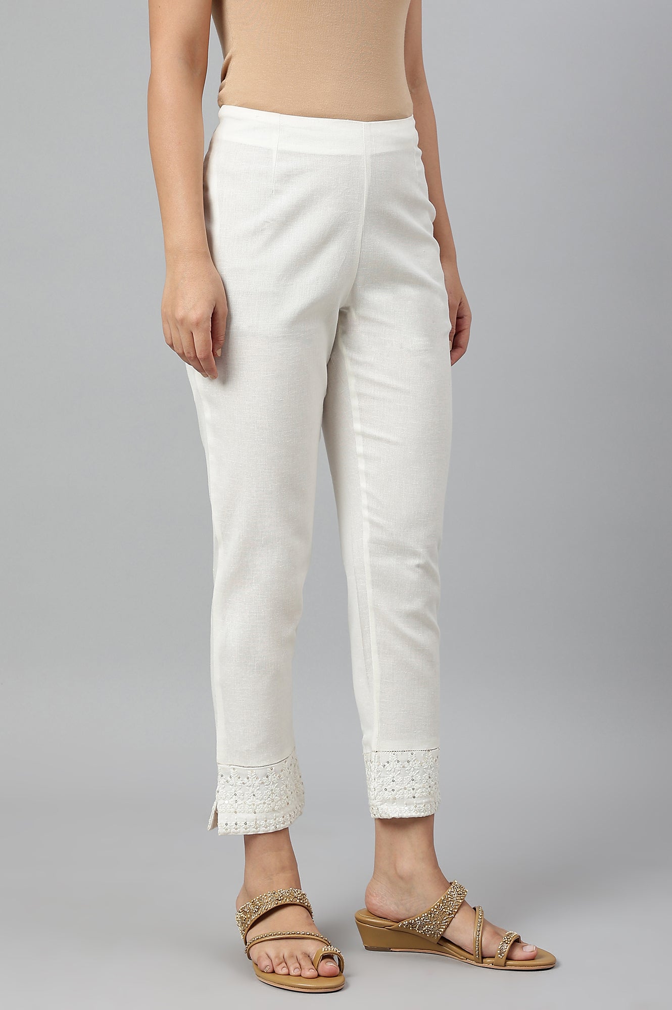 Ecru Slim Pants With Embroidered Hem