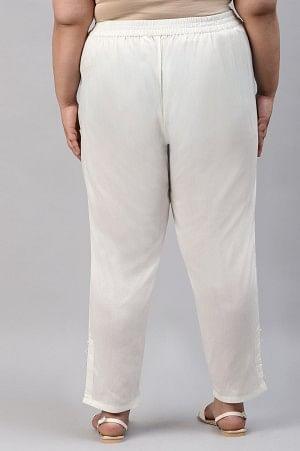 Ecru Solid Light Festive Plus Size Slim Pants - wforwoman