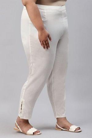 Ecru Solid Light Festive Plus Size Slim Pants - wforwoman