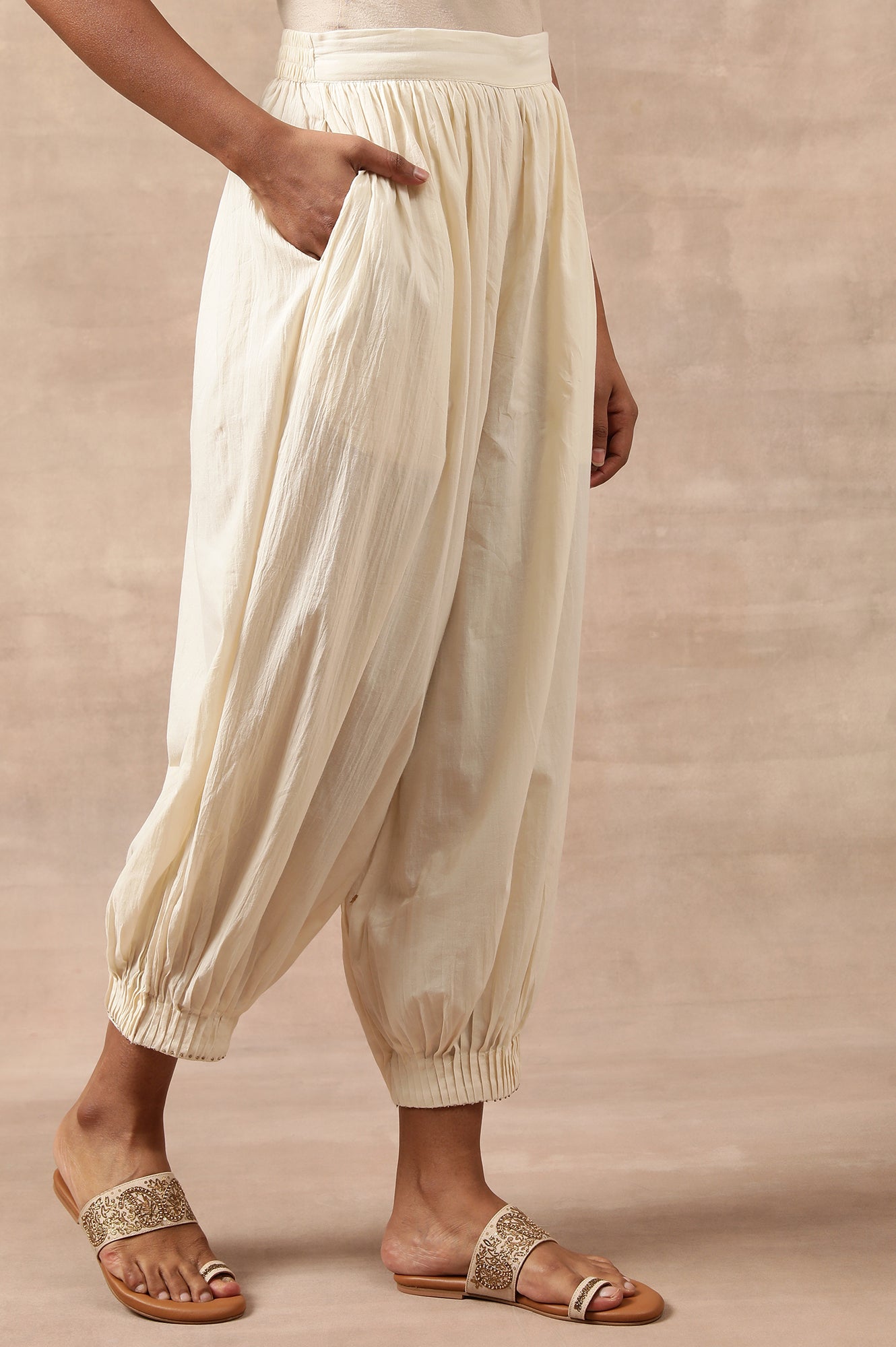 Cream Solid Beaded Tapered Cotton Salwar