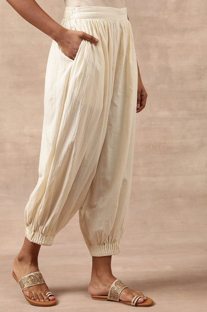 Cream Solid Beaded Tapered Cotton Salwar