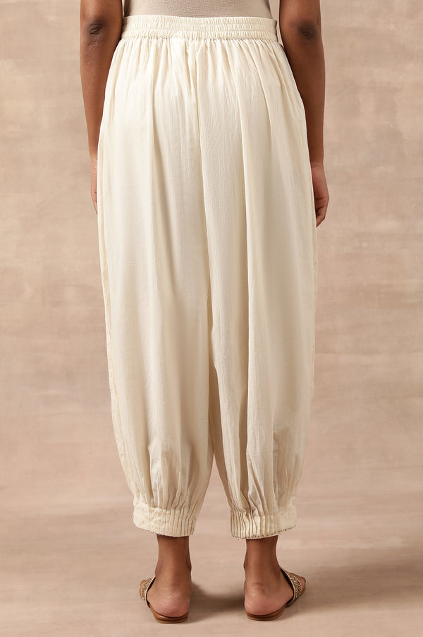 Cream Solid Beaded Tapered Cotton Salwar
