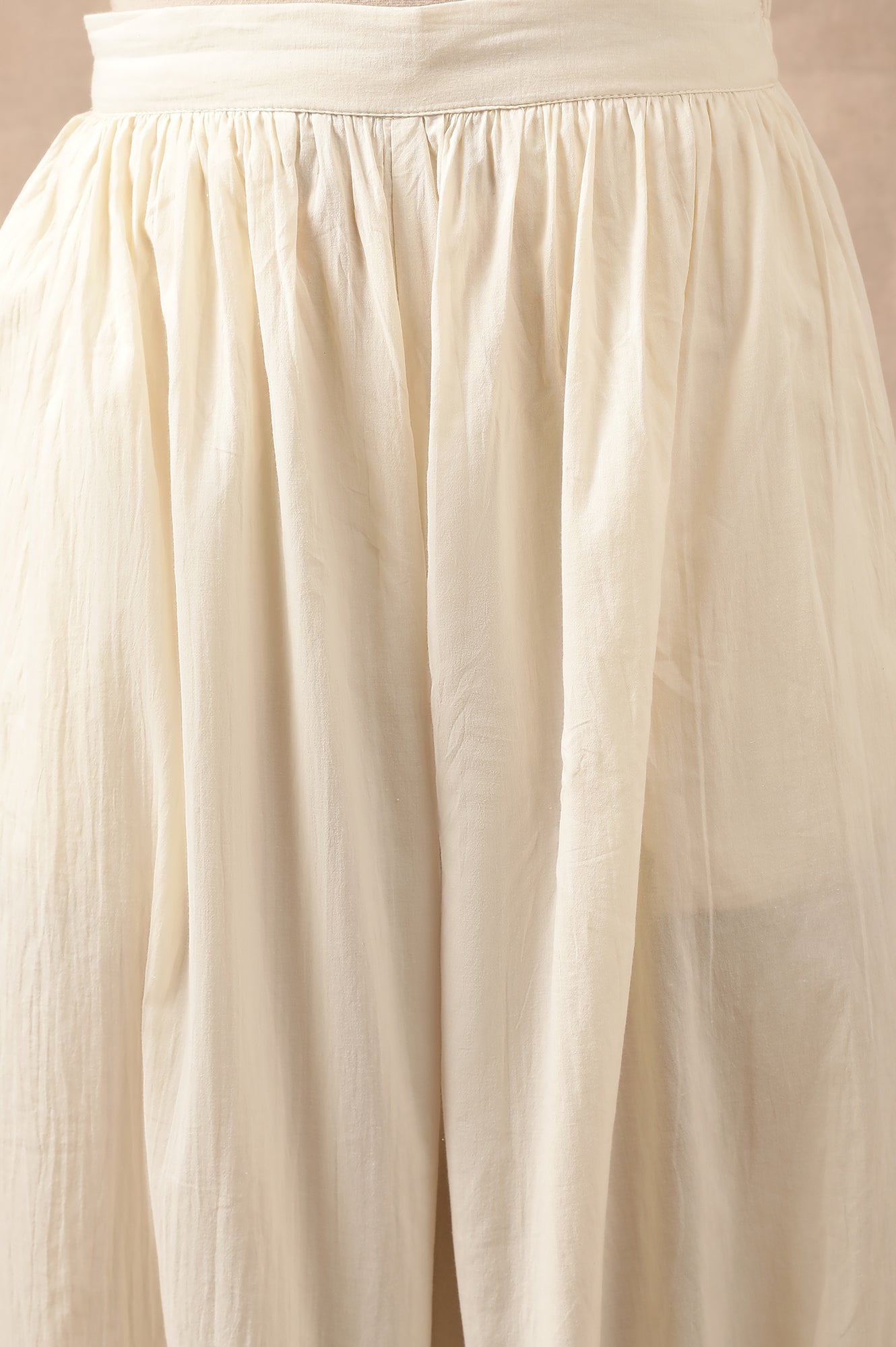 Cream Solid Beaded Tapered Cotton Salwar