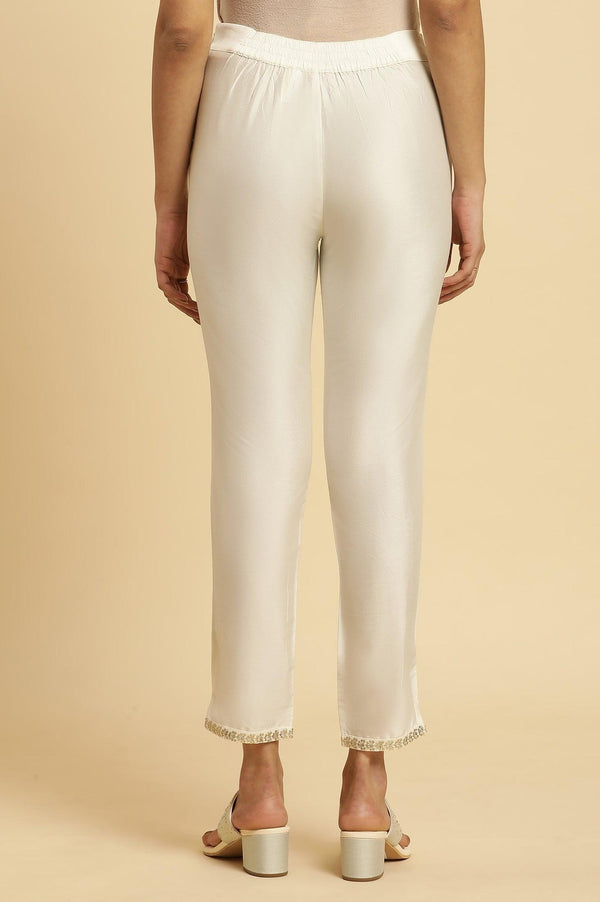 Ecru Slim Pants With Embroidered Hemline