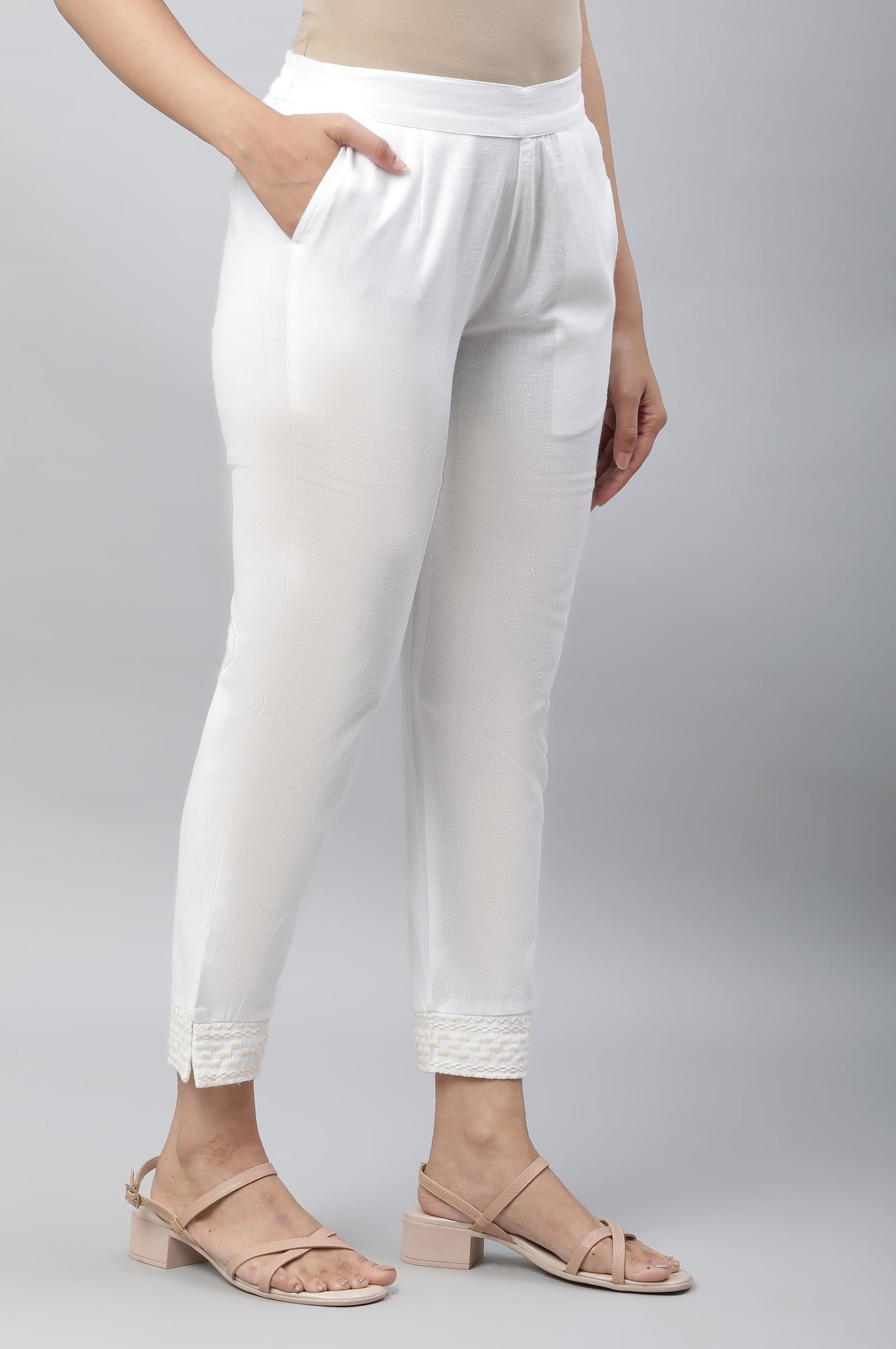 White Solid Straight Fit Cotton Trousers With Embroidered Hemline