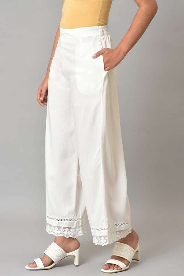 Ecru Parallel Pants With Lace At Hemline