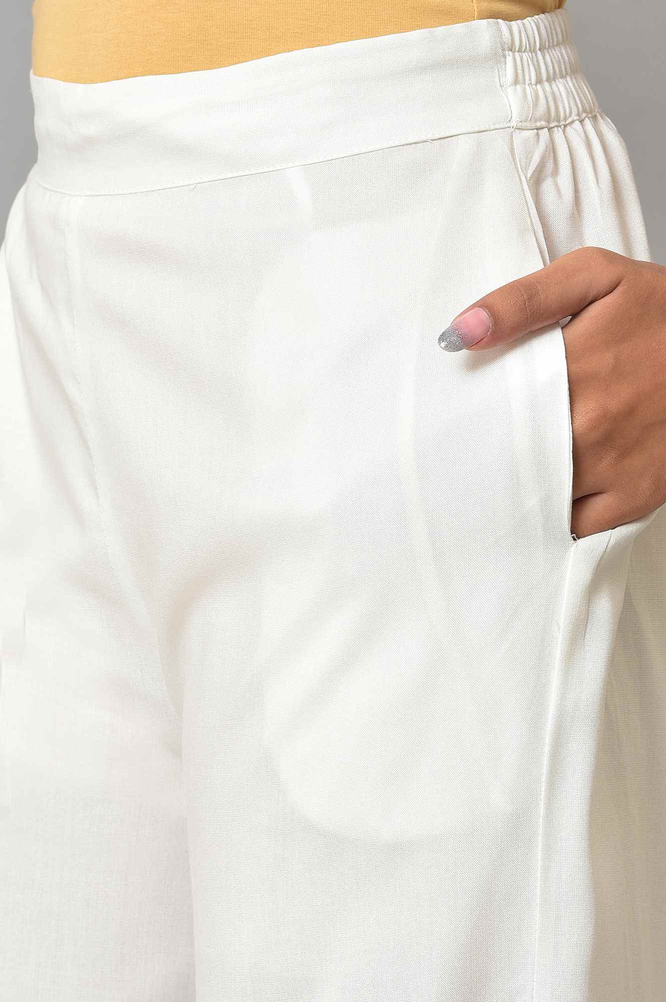 Ecru Parallel Pants With Lace At Hemline