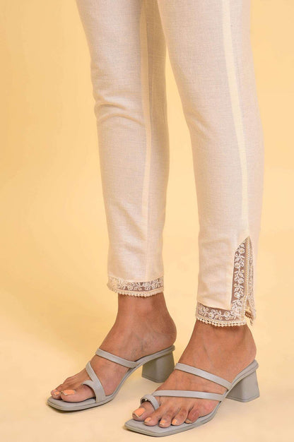 Ecru Solid Slim Pants With Lace On Hem - wforwoman