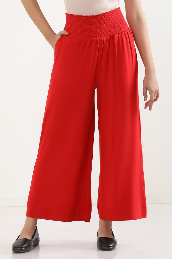 Red Solid Flared Pants With Smocked Waistbelt