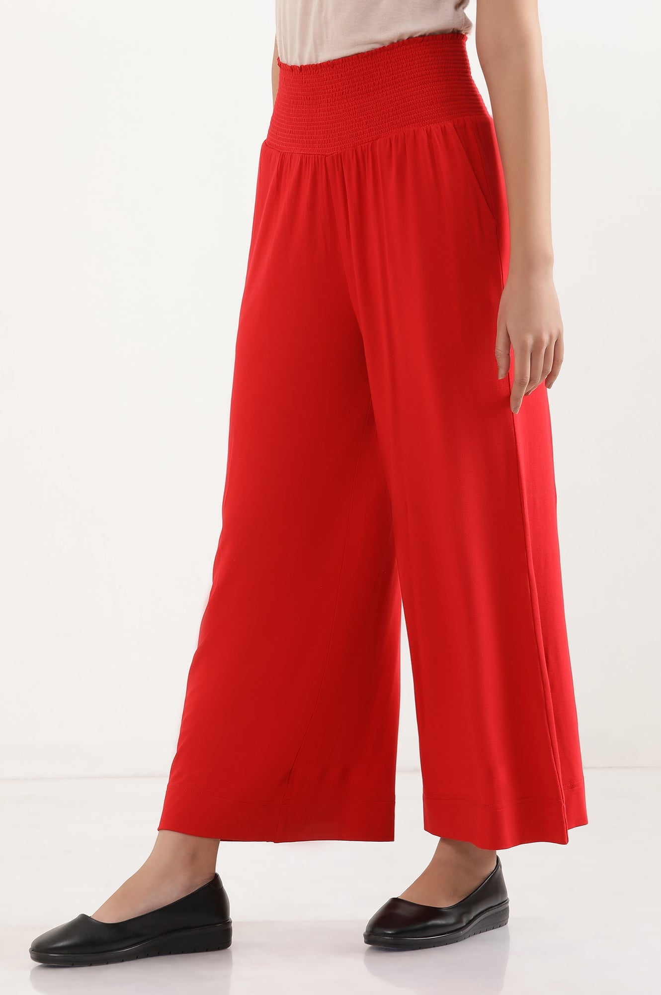 Red Solid Flared Pants With Smocked Waistbelt