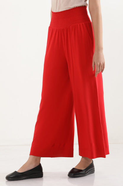 Red Solid Flared Pants With Smocked Waistbelt