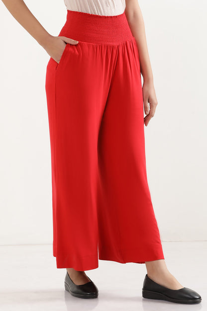 Red Solid Flared Pants With Smocked Waistbelt
