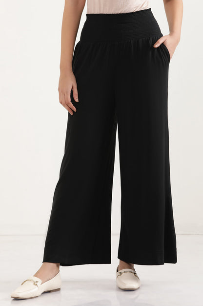 Black Solid Flared Pants With Smocked Waistbelt