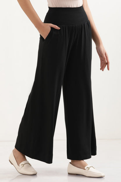 Black Solid Flared Pants With Smocked Waistbelt