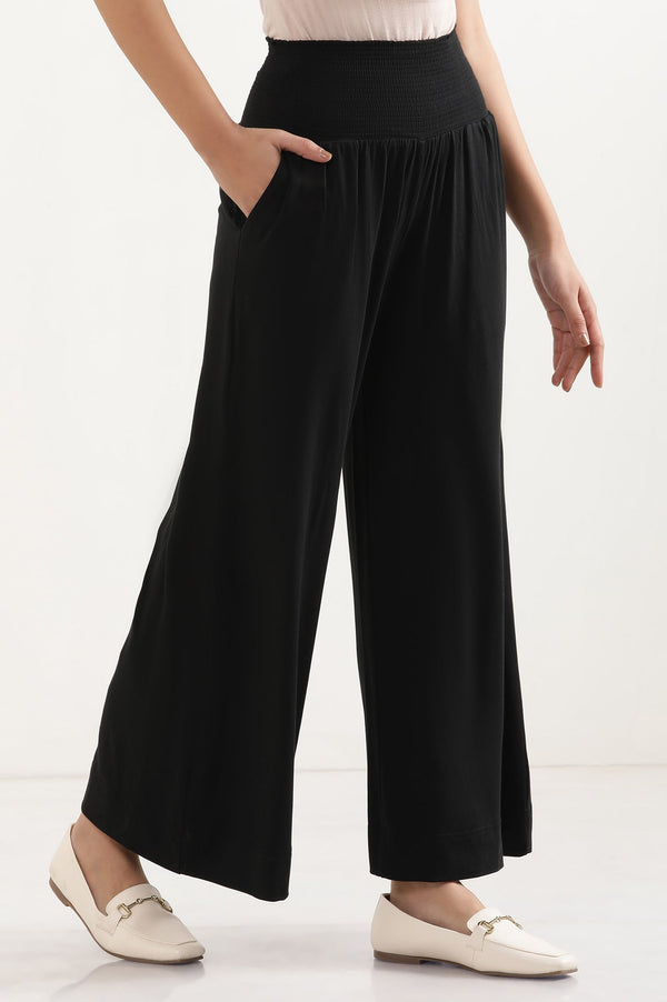 Elleven Women's Black Solid Flared Pants With Smocked Waistbelt