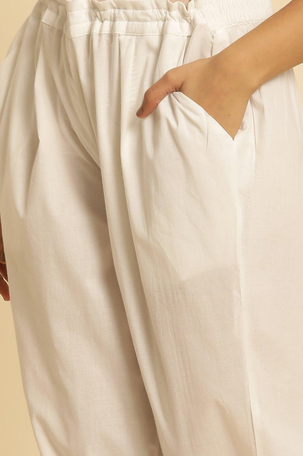 Ecru Straight Pants With Embroidered Hemline