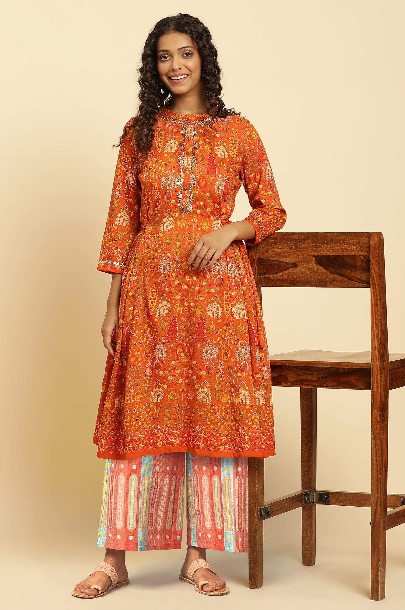 Orange Floral Printed Sequins A-Line Kurta and Parallel Pant Set