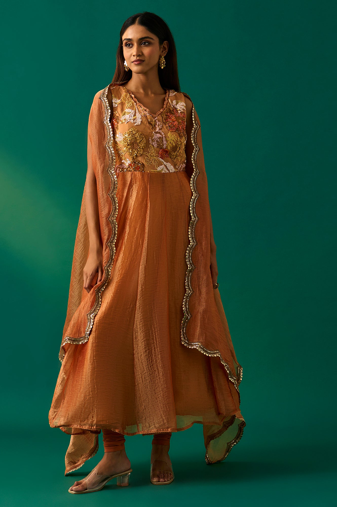 Orange Embroidered Flared Net Dress with Churidar and Cape Set