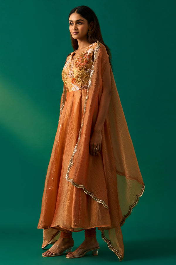 Orange Embroidered Flared Net Dress with Churidar and Cape Set